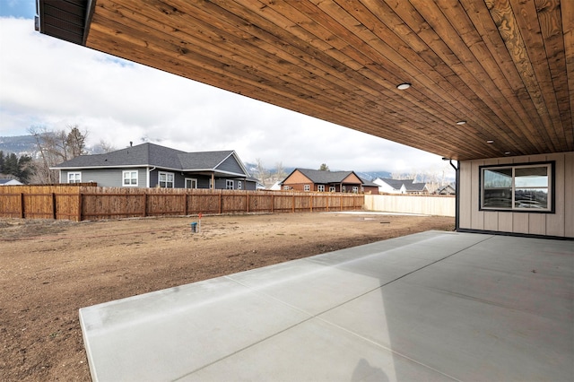 view of yard featuring a patio area and a fenced backyard