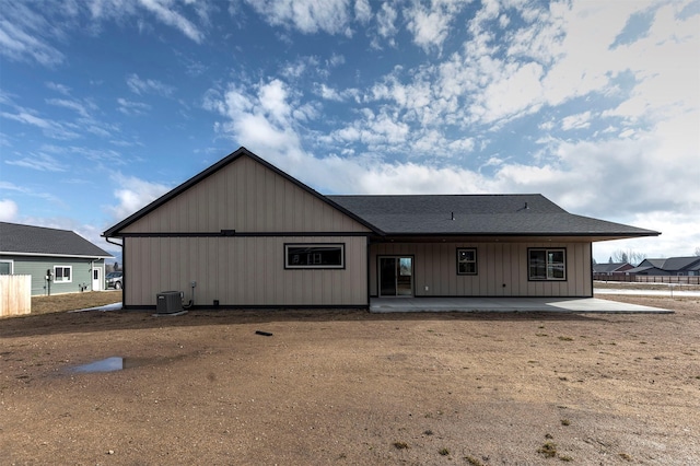 view of front of property with cooling unit and a patio area