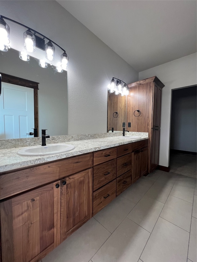 bathroom with tile patterned floors and vanity