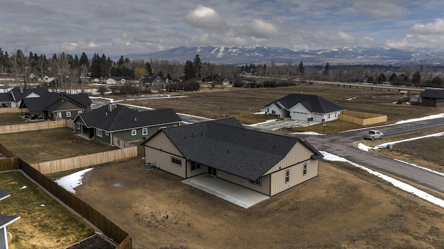 birds eye view of property with a mountain view