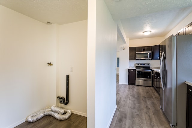 interior space featuring light hardwood / wood-style floors and a textured ceiling