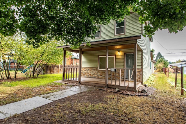 view of front of home with a front lawn and a porch