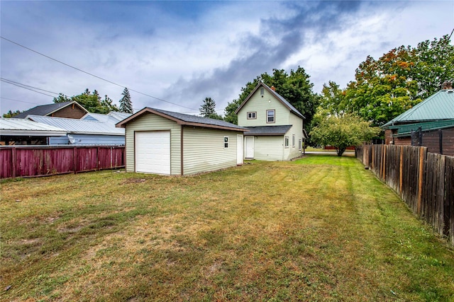 view of yard with an outbuilding and a garage