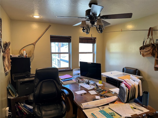 office space with a textured ceiling and ceiling fan