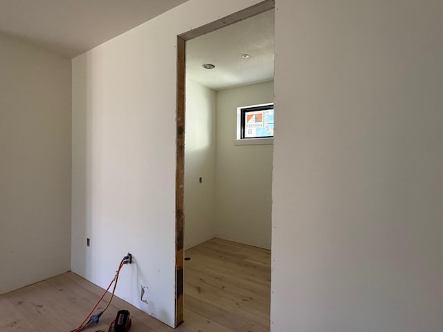 hallway with light wood finished floors
