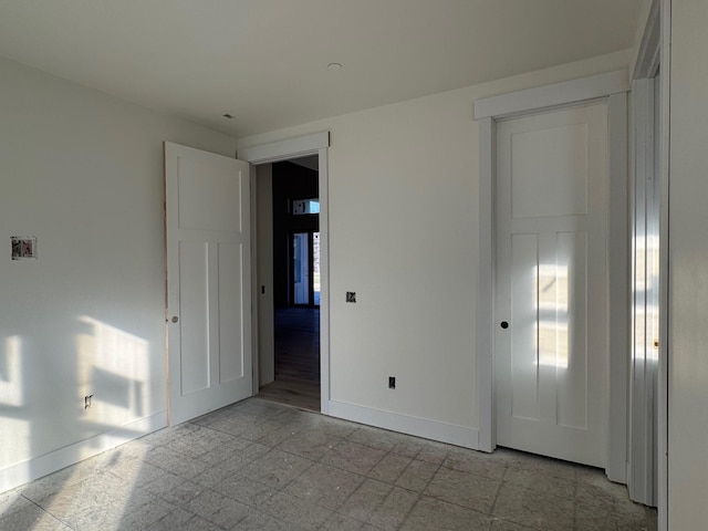 empty room with baseboards
