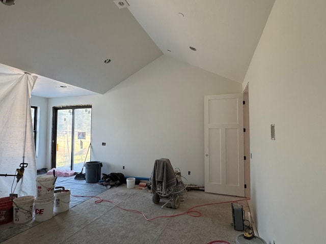 unfurnished living room with lofted ceiling