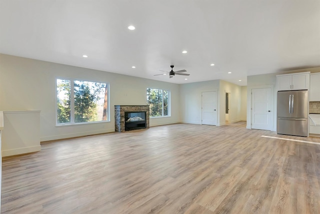 kitchen with white cabinets, appliances with stainless steel finishes, wall chimney exhaust hood, and sink