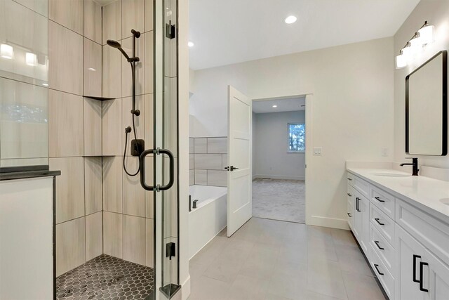 kitchen featuring dark stone countertops, white cabinetry, sink, and stainless steel dishwasher