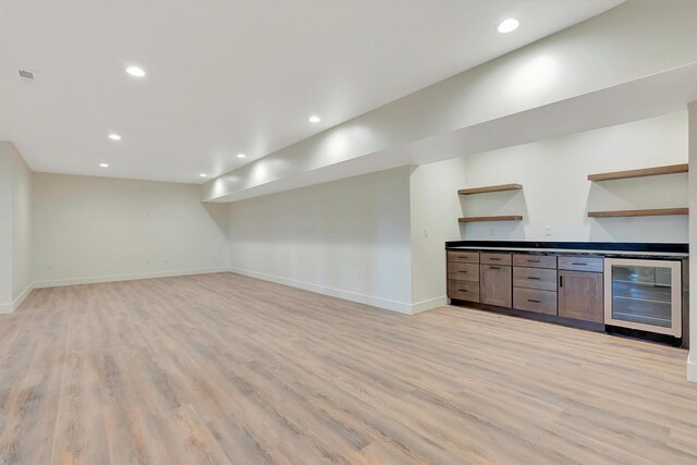 interior space with beverage cooler and light wood-type flooring