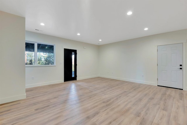 empty room with light wood-type flooring