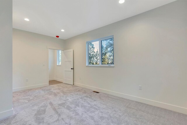 interior space featuring cabinets, washer hookup, light wood-type flooring, and hookup for an electric dryer