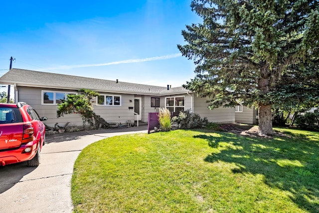 ranch-style home with a front lawn