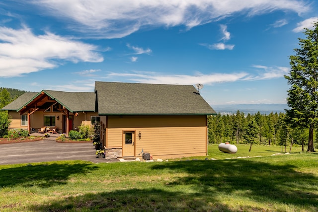 view of home's exterior featuring a yard