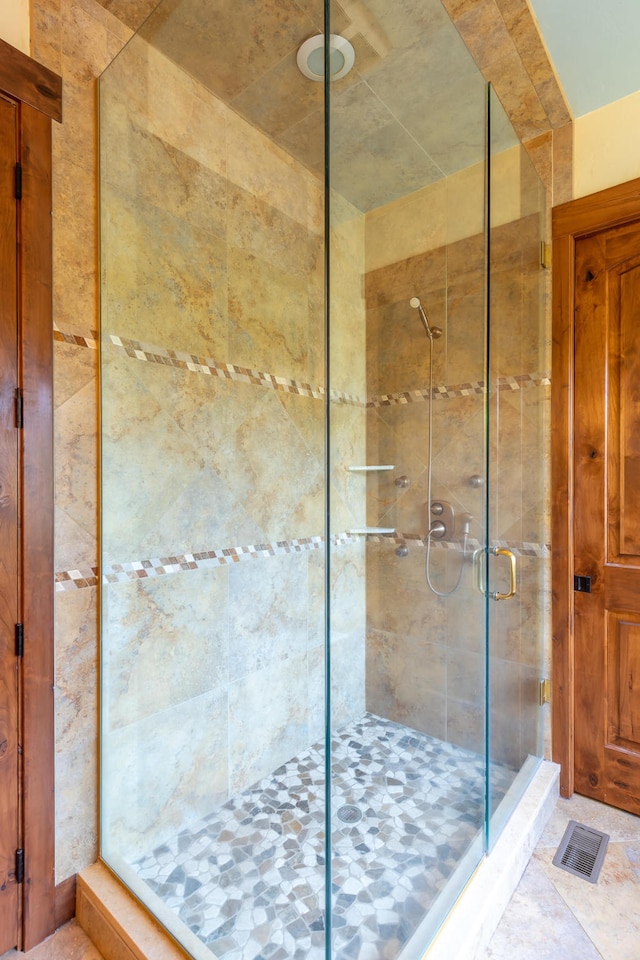 bathroom featuring an enclosed shower