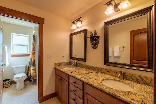 bathroom featuring curtained shower, tile patterned flooring, toilet, and vanity