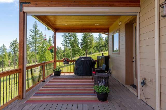 wooden deck with area for grilling