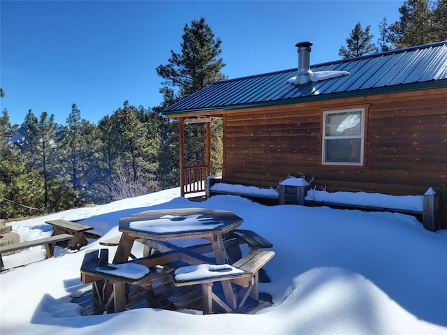 view of snow covered patio