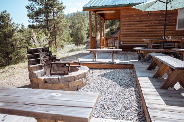 deck featuring a fire pit