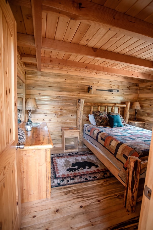 unfurnished bedroom with wood walls, wood-type flooring, wood ceiling, and beamed ceiling