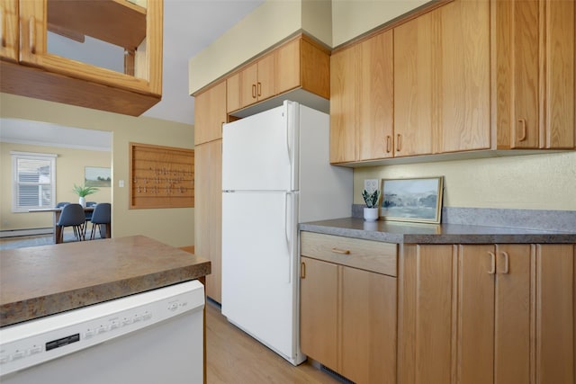 kitchen featuring white appliances and light wood-type flooring