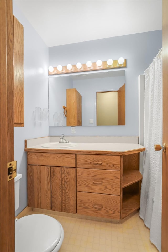 bathroom with vanity and toilet