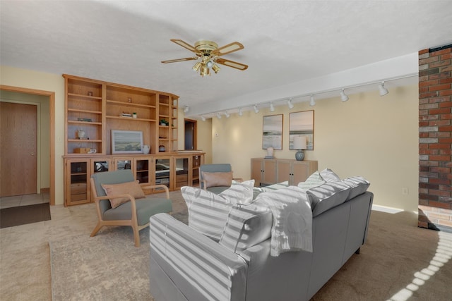 living room with light carpet and ceiling fan