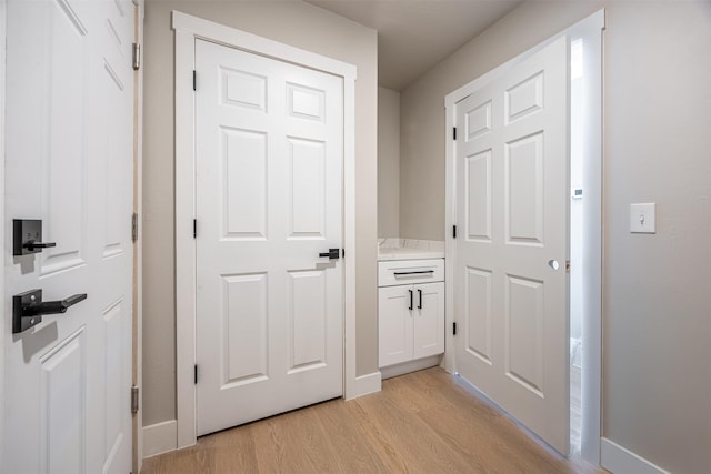 hallway featuring light hardwood / wood-style flooring