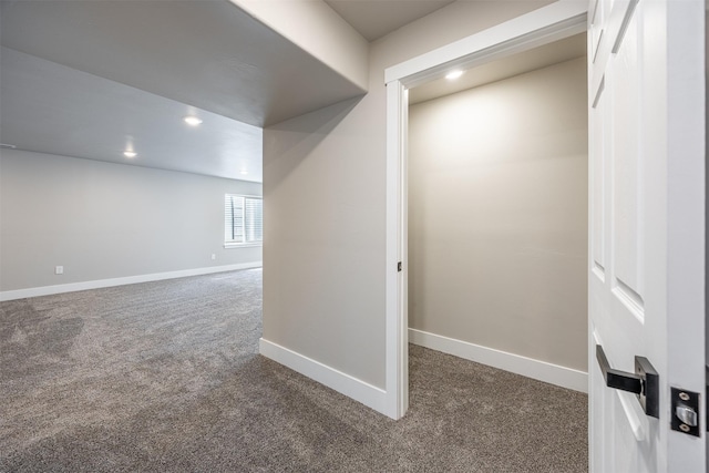 interior space featuring dark colored carpet