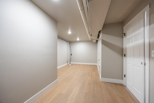 basement featuring light wood-type flooring