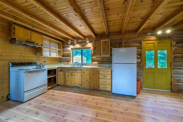 kitchen featuring white appliances, a wealth of natural light, and light hardwood / wood-style flooring