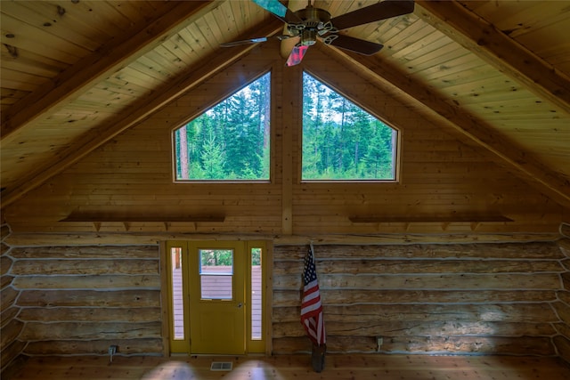 interior space with ceiling fan, hardwood / wood-style floors, beam ceiling, and wooden ceiling