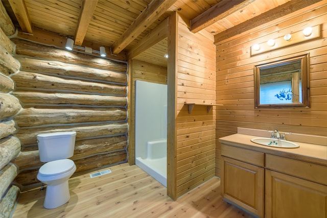 bathroom with wooden ceiling, hardwood / wood-style floors, toilet, beam ceiling, and vanity