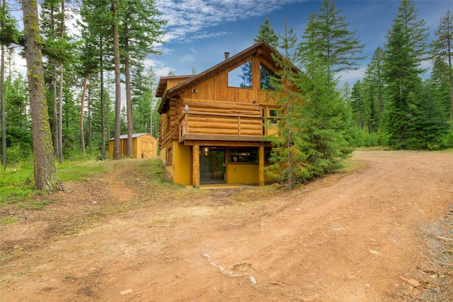 view of front of home with a storage unit