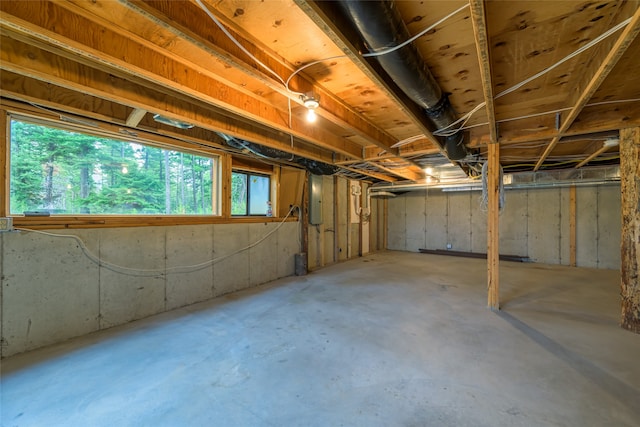 basement featuring electric panel