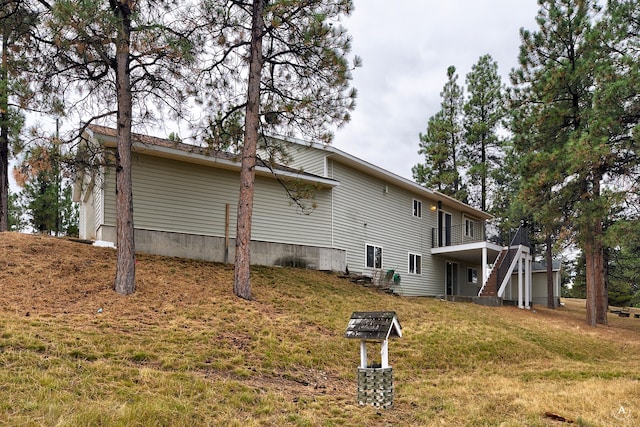 view of home's exterior featuring a lawn