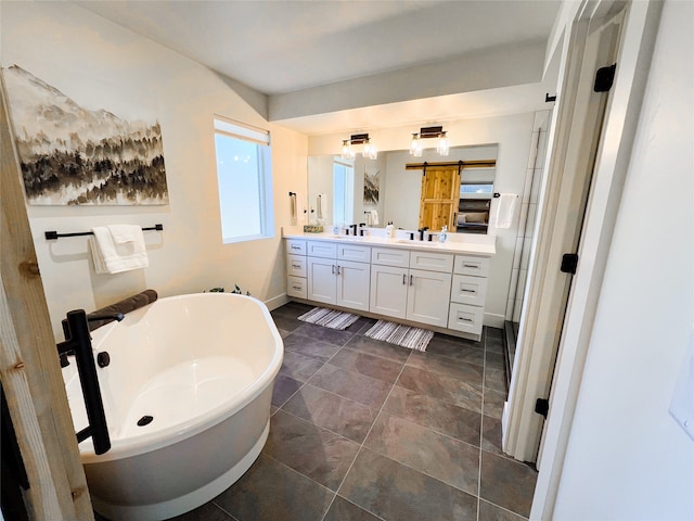 bathroom with a washtub and vanity