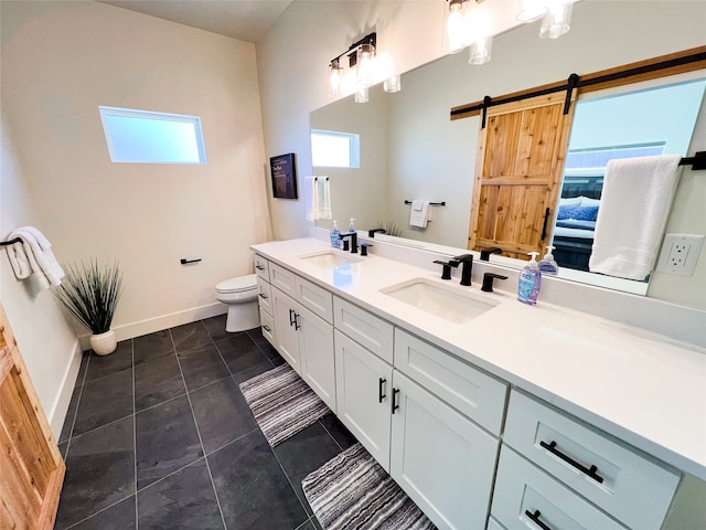 bathroom featuring tile patterned floors, toilet, and vanity