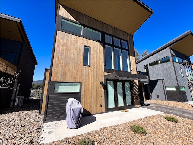 rear view of house featuring a garage