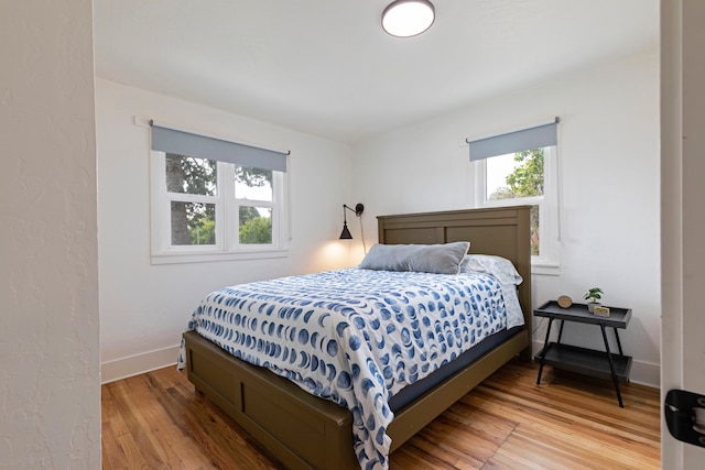 bedroom with hardwood / wood-style floors