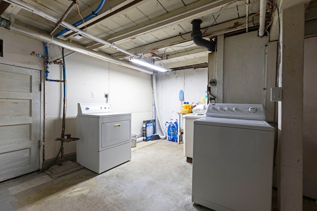 laundry area with washing machine and dryer