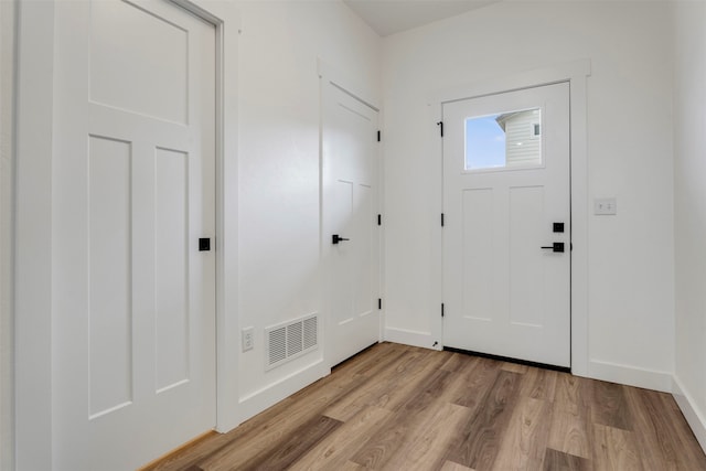 foyer entrance with light wood-type flooring