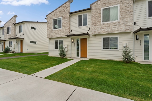 view of property featuring a front yard