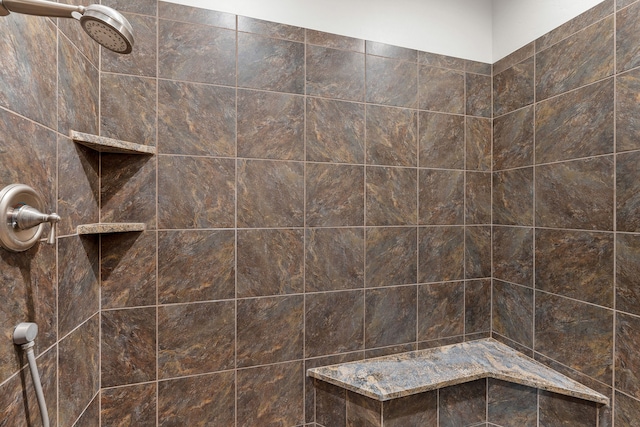 bathroom with a tile shower