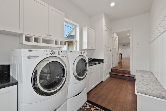 washroom featuring washer and clothes dryer, cabinets, dark hardwood / wood-style floors, and sink