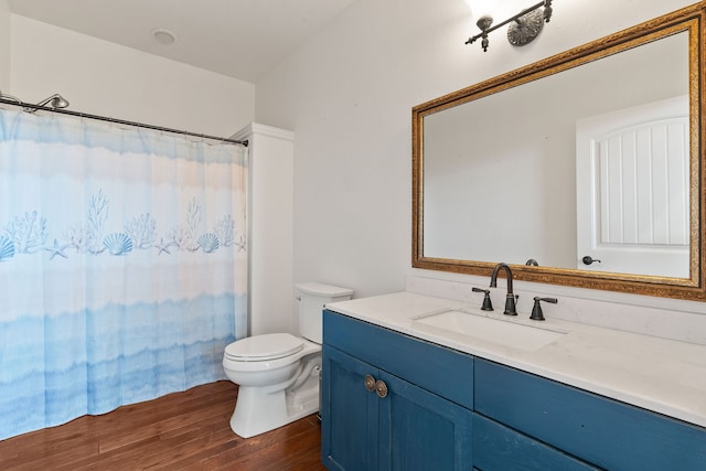 bathroom with a shower with curtain, vanity, toilet, and hardwood / wood-style flooring