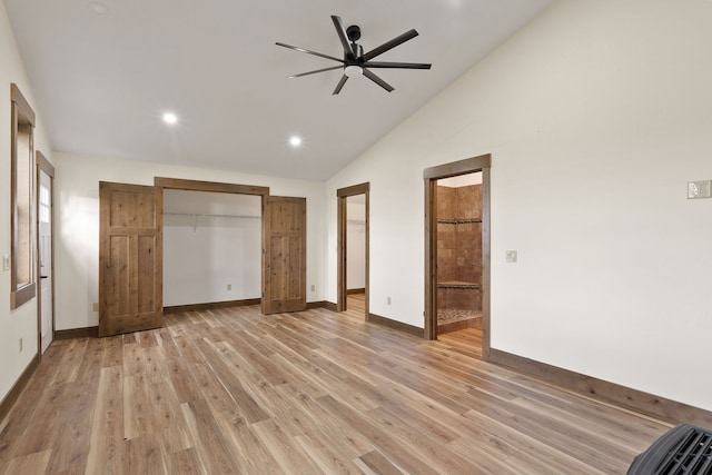 unfurnished bedroom with ceiling fan, light hardwood / wood-style flooring, and vaulted ceiling