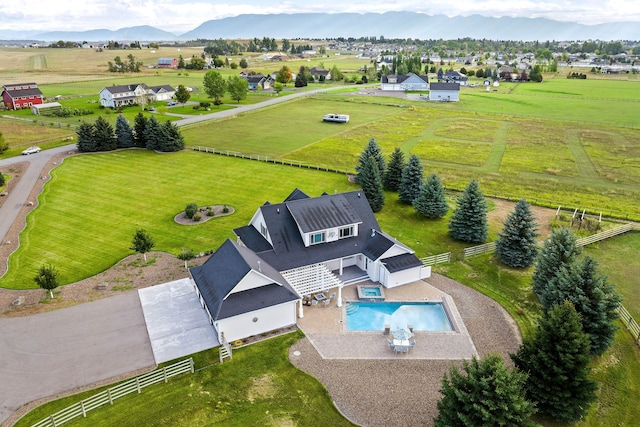 birds eye view of property with a mountain view