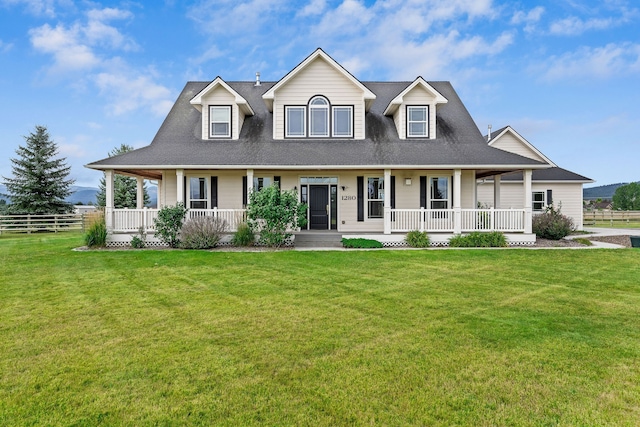 view of front of home featuring a front yard and covered porch