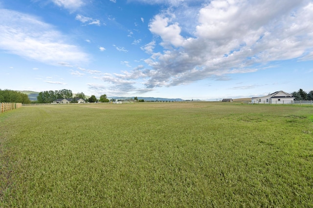 view of yard with a rural view